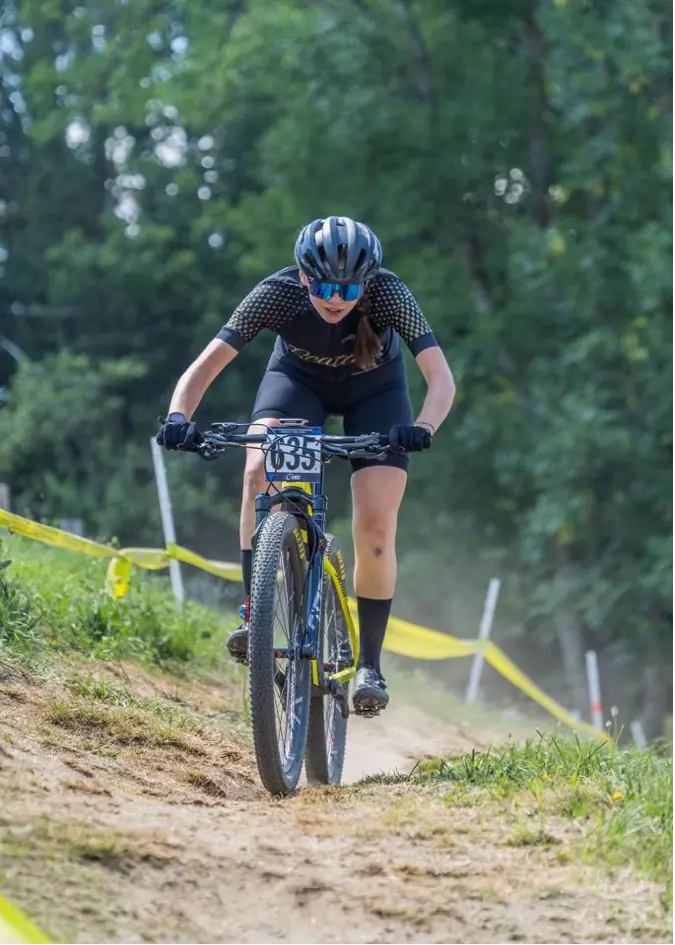 Laura Zberg riding a mountain bike